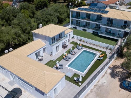 an aerial view of a house with a swimming pool at Sueño Suites in Parga