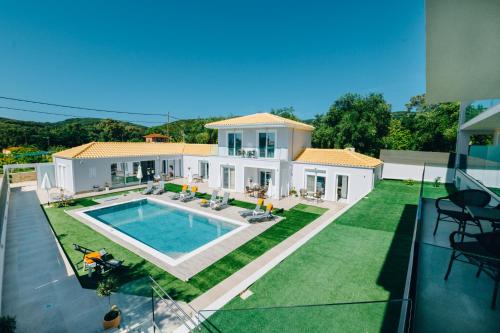 an aerial view of a house with a swimming pool at Sueño Suites in Parga