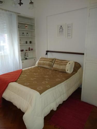 a bedroom with a large bed in a room at DTO 1AMB. RECOLETA in Buenos Aires