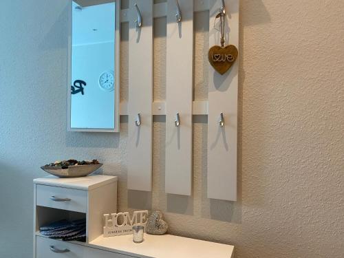 a bathroom with a mirror and a sink at Business Appartement Mainz Duo in Mainz