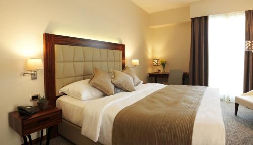 Postel nebo postele na pokoji v ubytování Grand Hotel Portoroz 4* superior – Terme & Wellness LifeClass
