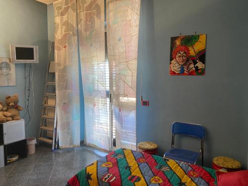 a bedroom with a bed and a painting on the wall at Dimora Nina in Sannicandro di Bari