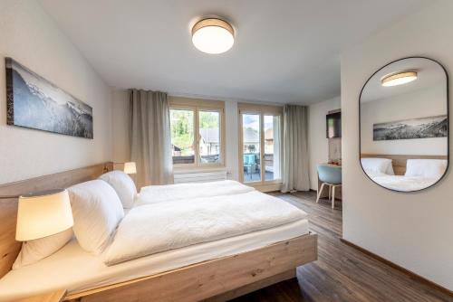 Postel nebo postele na pokoji v ubytování Hotel Restaurant Urweider