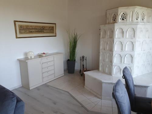 a living room with a desk and a dresser at Ferienwohnung Schlossblick Bad Breisig in Bad Breisig