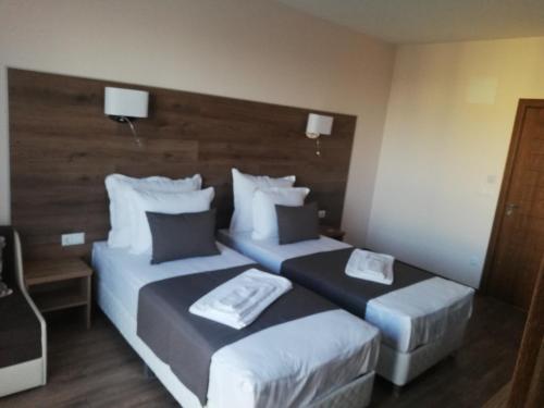 a hotel room with two beds in a room at Hotel Vanilla, Varna - Free parking in Varna City