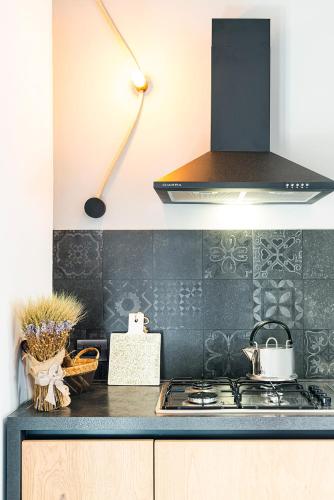 a kitchen with a stove and a counter top at BORGO DEL FRANCO in Castellabate