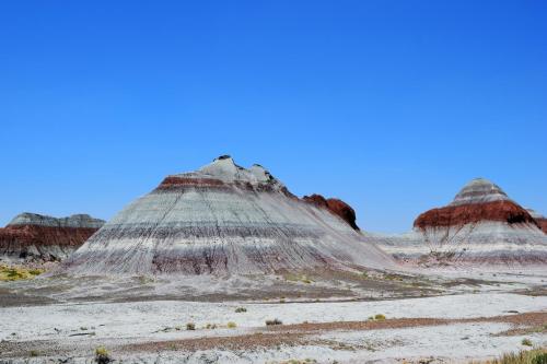 a group of hills in the desert at Starlight Tent 2 in Holbrook