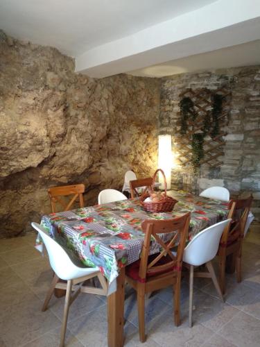 a dining room with a table and chairs at Casas Los Carabos El Refugio in Letur