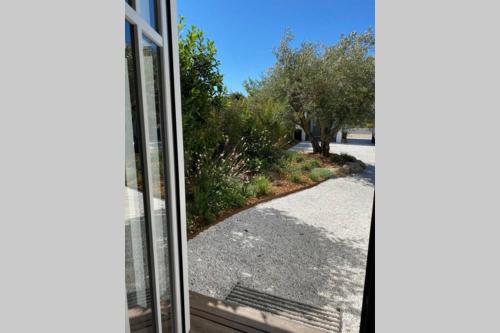 a view from a window of a driveway at Elégante maison d'architecte, Spa à débordement in La Noue