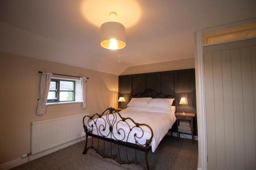 A bed or beds in a room at The Old Cider House