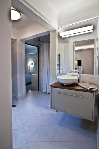 a bathroom with a sink and a mirror at kolonaki Penthouse panoramic Acropolis view in Athens