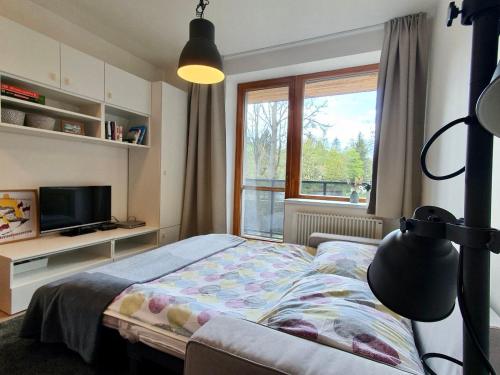 Postel nebo postele na pokoji v ubytování Apartmány 50