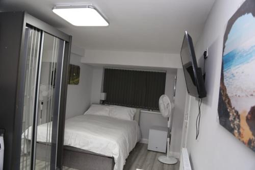 מיטה או מיטות בחדר ב-Budget Ensuite Room Woolwich