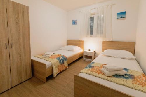 Postel nebo postele na pokoji v ubytování House Moro