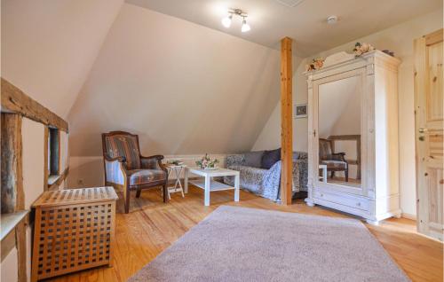 a living room with a couch and a table at 3 Bedroom Cozy Home In Thandorf in Thandorf