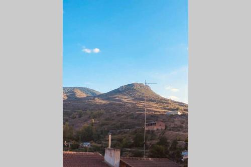 a view of a hill with a mountain in the background at Casa El calado in Viguera