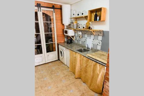 a kitchen with a sink and a counter top at Casa El calado in Viguera