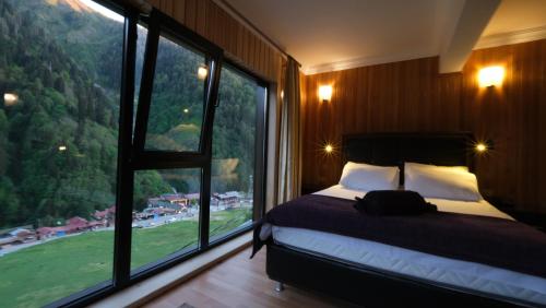 Letto o letti in una camera di Ayder Villa de Pelit Hotel