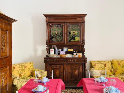 a living room with two tables and a cabinet at B&B Ca' Dor in Venice