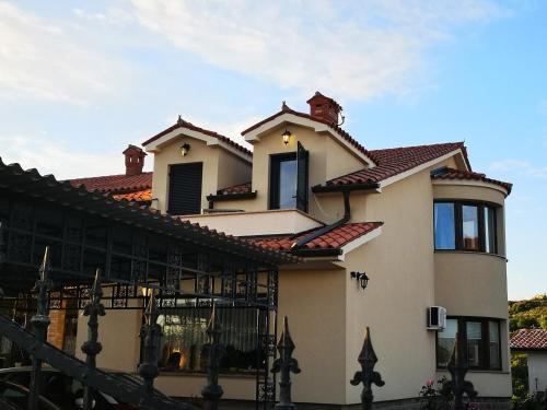 a large white building with a red roof at Apartma Isabella in Sečovlje