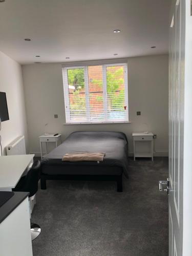 A bed or beds in a room at Self contained ensuite double bedroom with own entrance FREE OFF STREET PARKING