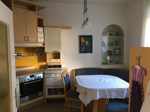 a small kitchen with a table and a table and chairs at Poltnigg in Arnfels
