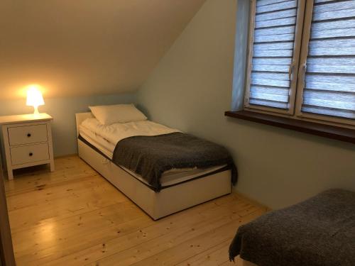 Posteľ alebo postele v izbe v ubytovaní Kokosowy Zakątek