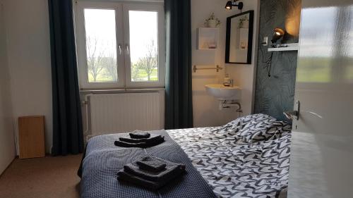 En eller flere senge i et værelse på Sportpension Heartstay