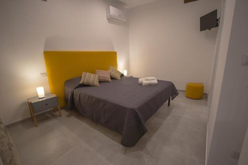 a bedroom with a bed with two towels on it at Casanica-Taormina in Taormina