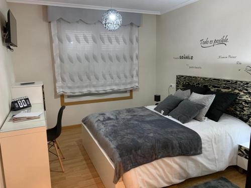A bed or beds in a room at A&M Burela Costa