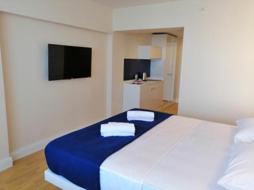 Postel nebo postele na pokoji v ubytování Subtropik Apartments in Batumi