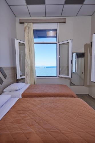 Ένα ή περισσότερα κρεβάτια σε δωμάτιο στο Amalia City Rooms