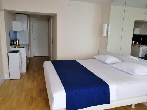 Postel nebo postele na pokoji v ubytování Subtropik Apartments in Batumi