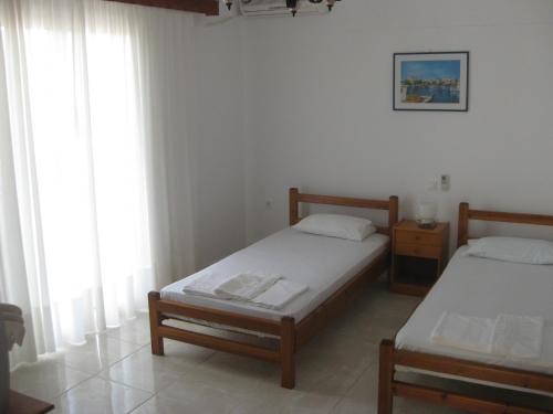 A bed or beds in a room at Maravelias House