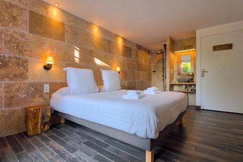 a hotel room with a bed and a dresser at GOOD KNIGHT in Carcassonne