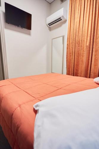Ένα ή περισσότερα κρεβάτια σε δωμάτιο στο Amalia City Rooms