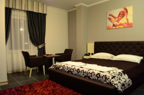 Postel nebo postele na pokoji v ubytování Hotel Mustang
