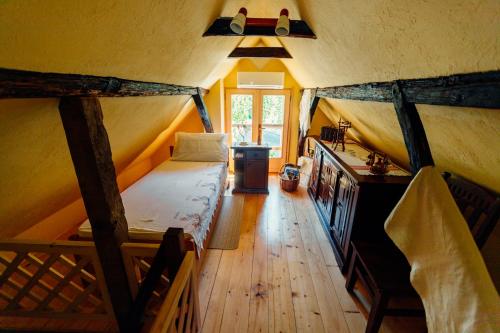 a room with a bed in a tent at Kmečka hiša Bahor in Črnomelj