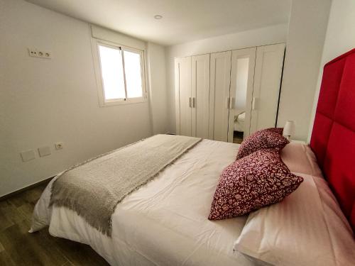 Posteľ alebo postele v izbe v ubytovaní Apartamentos La Libertad 1