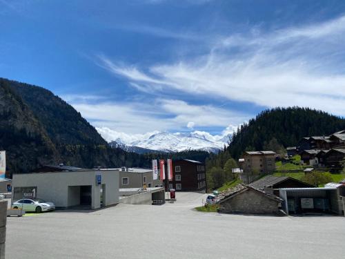 a parking lot with mountains in the background at Residenz Panorama - Blatten bei Naters VS in Blatten bei Naters