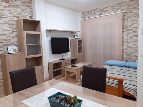 TV a/nebo společenská místnost v ubytování Casa Herrera