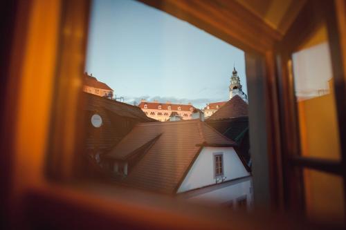 a view of a building from a window at Babyka Apartments in Český Krumlov
