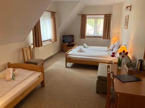Postel nebo postele na pokoji v ubytování Hotel Habenda