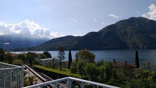a view of a body of water with a mountain at Hotel Lario in Mezzegra