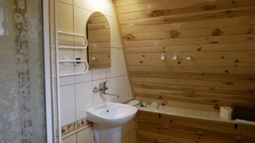 a bathroom with a toilet and a sink at Pokoje DAJAN in Łeba