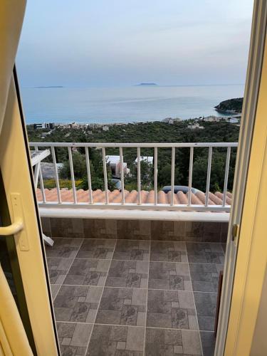 a balcony with a view of the ocean at Persephone in Himare