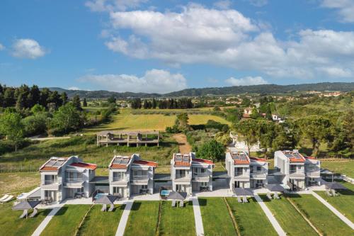 an aerial view of a large house with a yard at V Luxury Apartments Posidi in Possidi