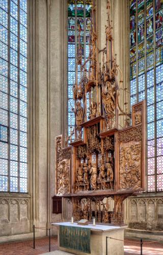 a large wooden structure in a room with windows at Hotel Sonne - Das kleine Altstadt Hotel in Rothenburg ob der Tauber