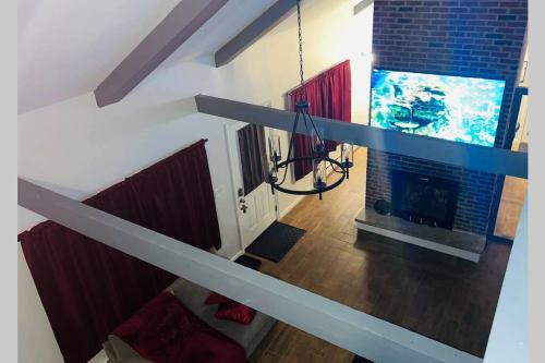 an overhead view of a living room with a fireplace at Comtemporary, Confortable, Well Appointed Home. in Tobyhanna