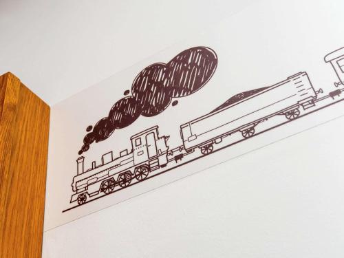 a drawing of a train on a wall at ibis Styles Crewe in Crewe
